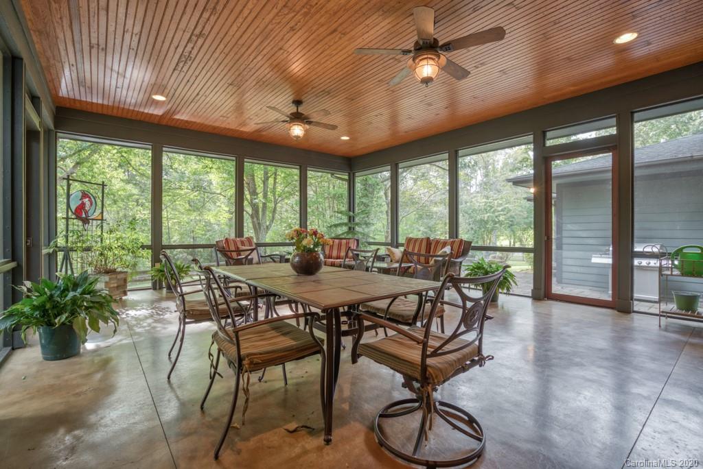 305 Misty Hill Road Columbus, NC 28722 - Photo 16 of 46 a view of a dining room with furniture window and outside view
