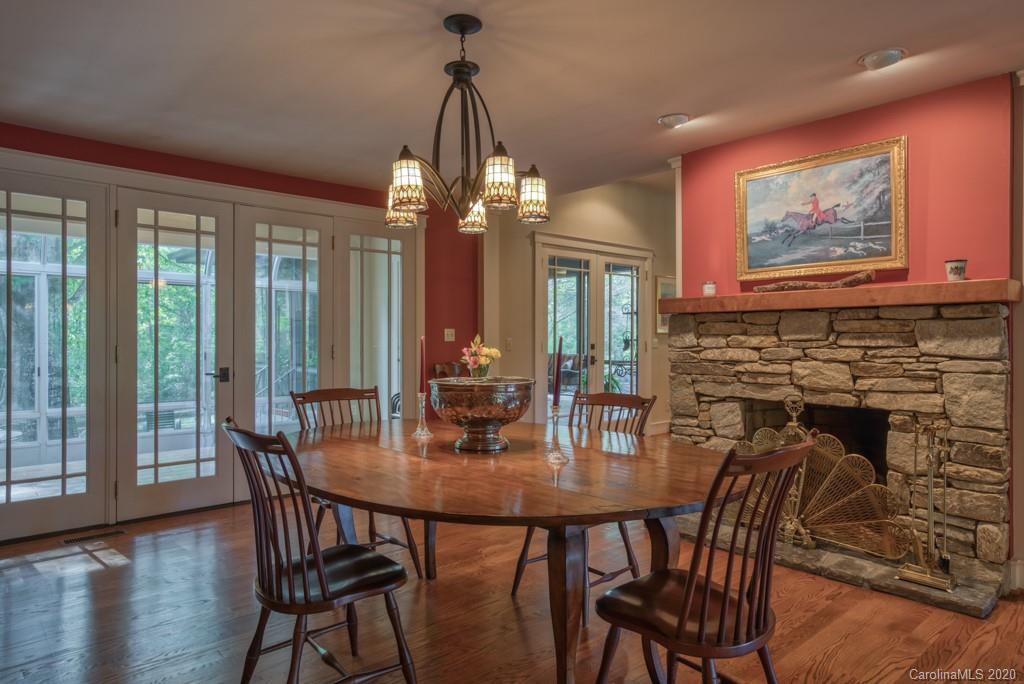 305 Misty Hill Road Columbus, NC 28722 - Photo 18 of 46 a view of a dining room with furniture window and wooden floor