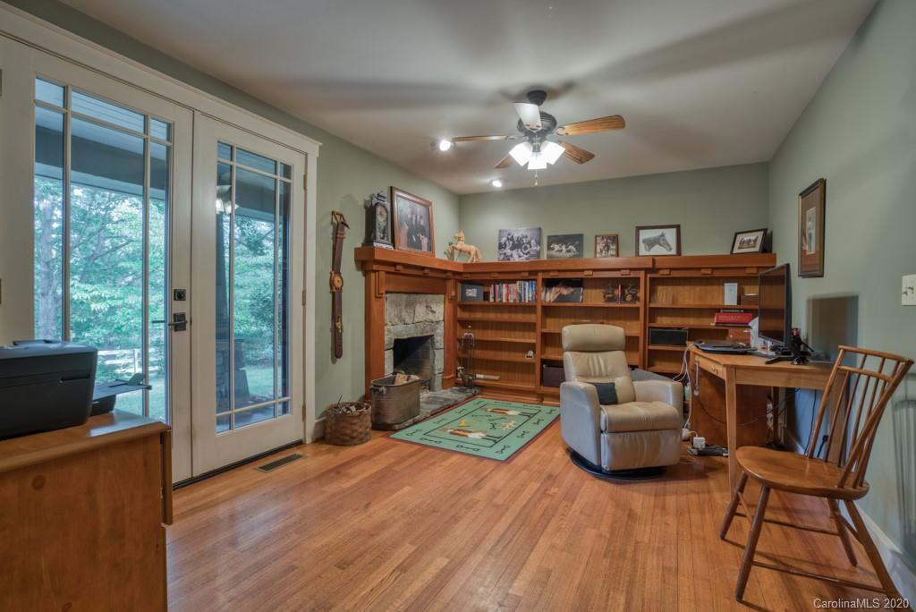 305 Misty Hill Road Columbus, NC 28722 - Photo 20 of 46 a view of a livingroom with furniture and a ceiling fan