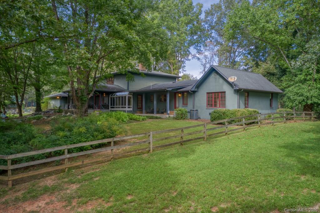 305 Misty Hill Road Columbus, NC 28722 - Photo 3 of 46 a front view of a house with a yard