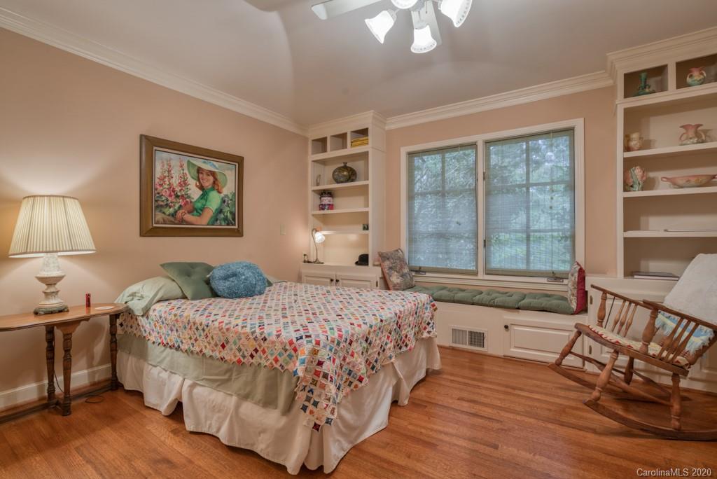305 Misty Hill Road Columbus, NC 28722 - Photo 24 of 46 a bedroom with a large bed and a window
