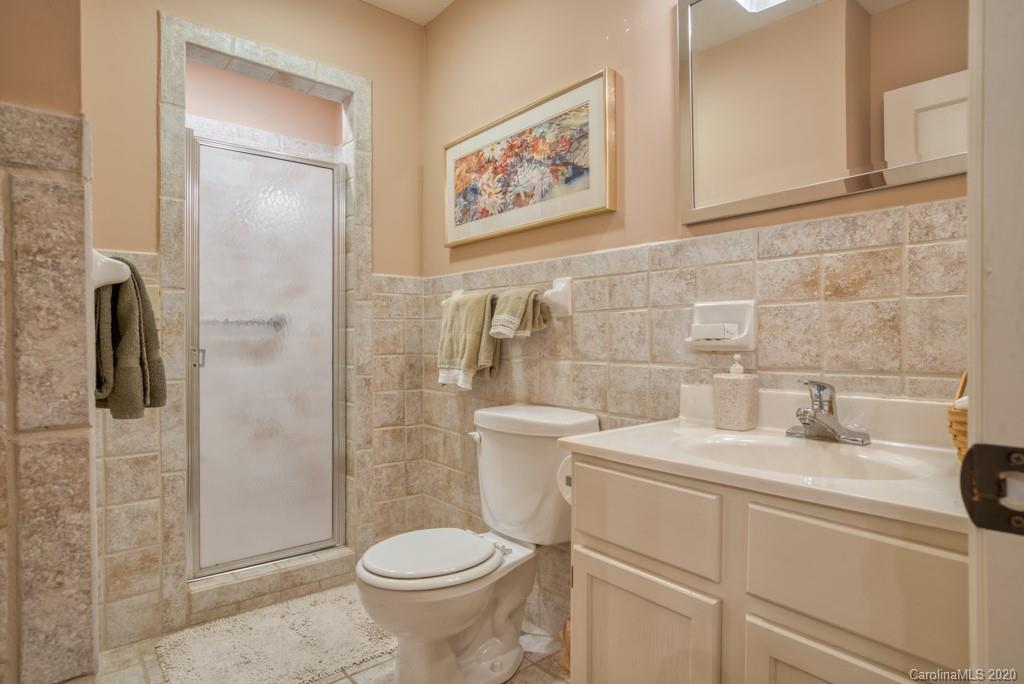 305 Misty Hill Road Columbus, NC 28722 - Photo 25 of 46 a bathroom with a toilet sink and shower