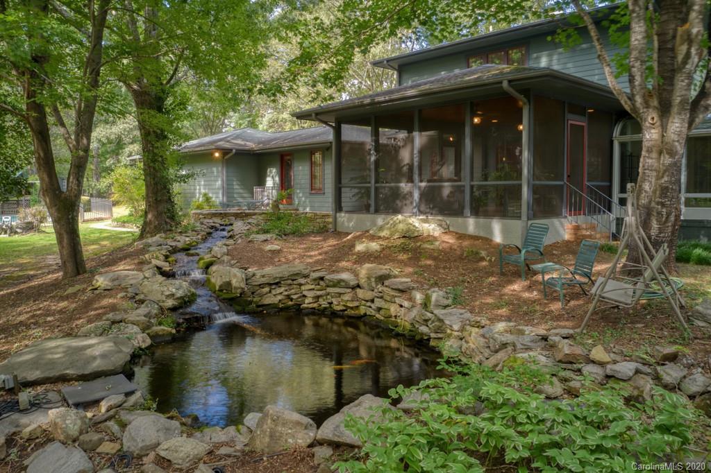 305 Misty Hill Road Columbus, NC 28722 - Photo 4 of 46 a view of a house with a yard