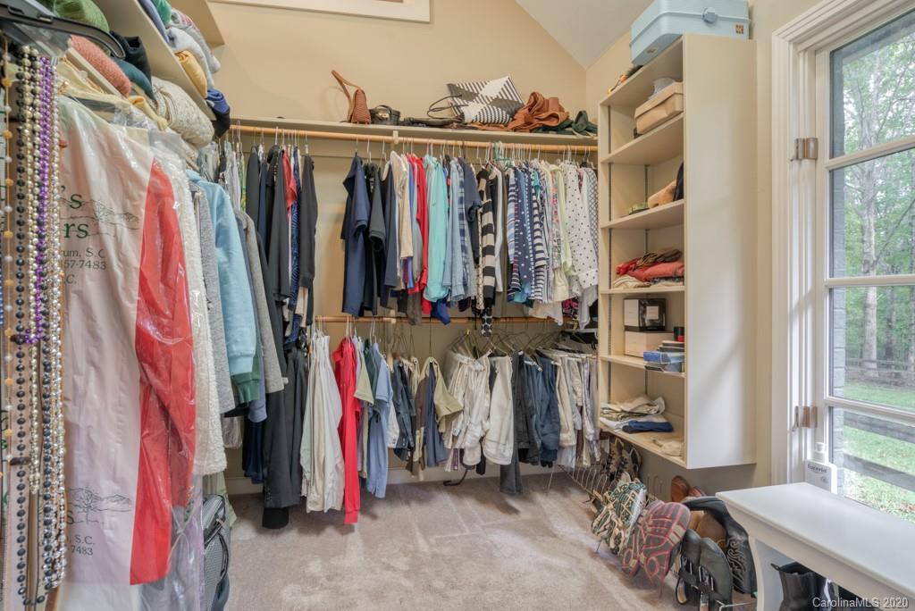 305 Misty Hill Road Columbus, NC 28722 - Photo 31 of 46 a view of walk in closet with clothes