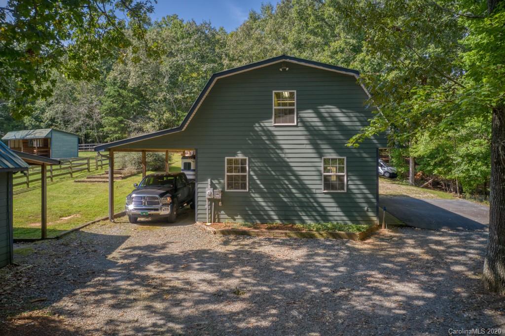 305 Misty Hill Road Columbus, NC 28722 - Photo 36 of 46 a view of a house with a yard