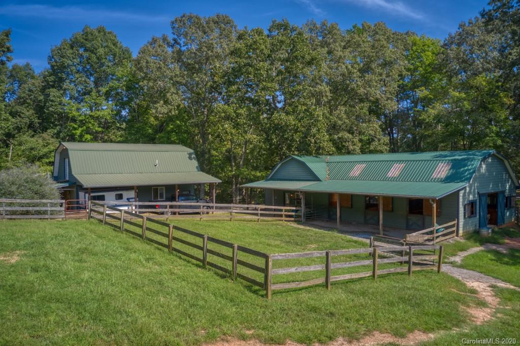 305 Misty Hill Road Columbus, NC 28722 - Photo 40 of 46 a view of a house with pool and a yard