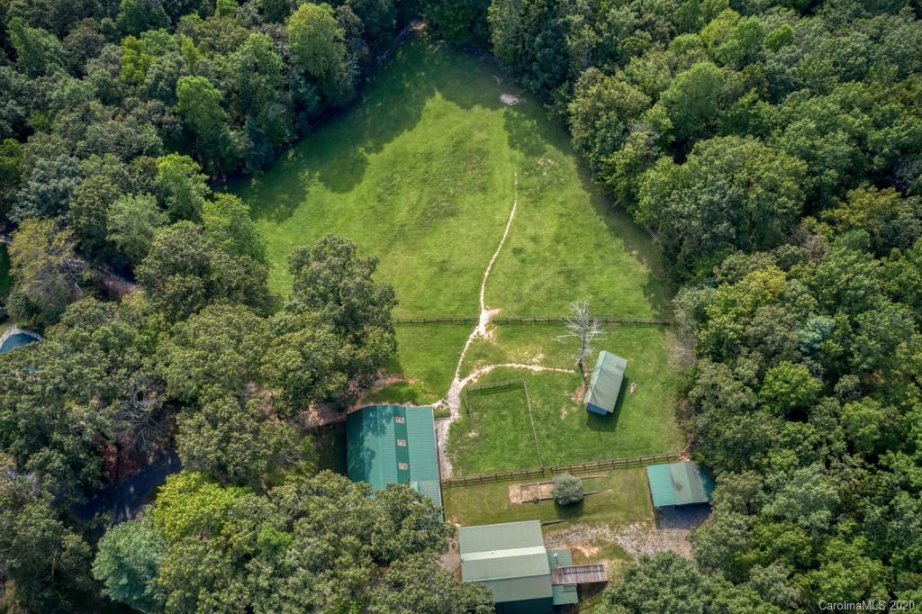 305 Misty Hill Road Columbus, NC 28722 - Photo 5 of 46 an aerial view of residential house with outdoor space and trees all around