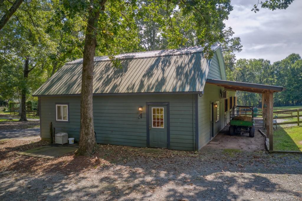 305 Misty Hill Road Columbus, NC 28722 - Photo 41 of 46 a view of a house with a yard
