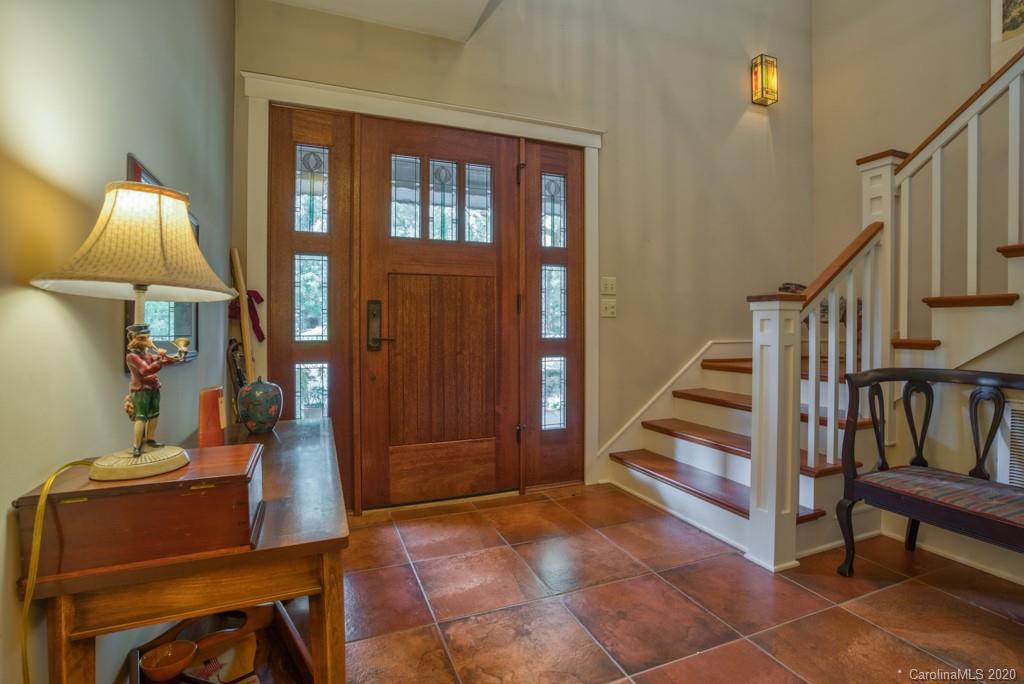 305 Misty Hill Road Columbus, NC 28722 - Photo 8 of 46 a view of a hallway with furniture and staircase