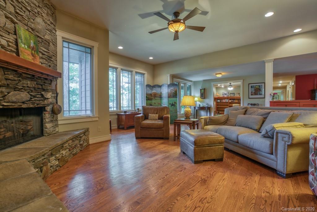 305 Misty Hill Road Columbus, NC 28722 - Photo 9 of 46 a living room with furniture and a fireplace