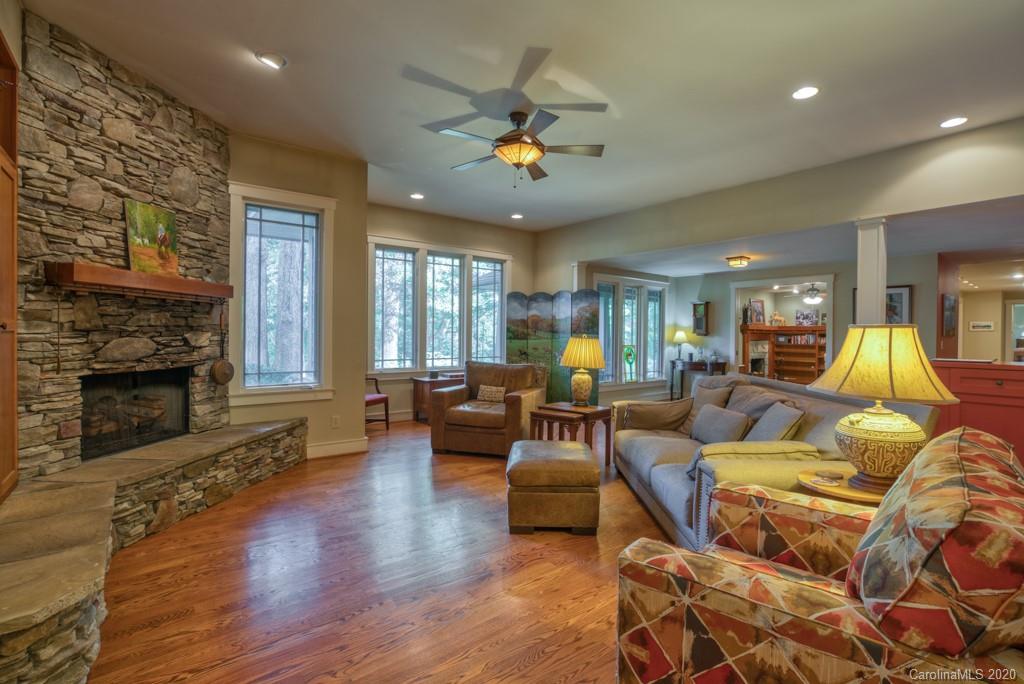 305 Misty Hill Road Columbus, NC 28722 - Photo 10 of 46 a living room with furniture and a fireplace