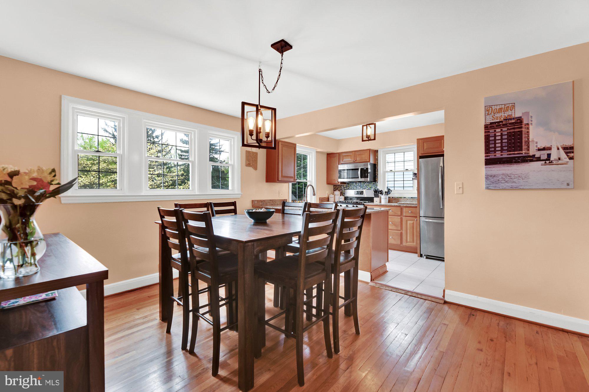 1107 Arran Road Baltimore, MD 21239 - Photo 14 of 29 a view of a dining room with furniture window and wooden floor