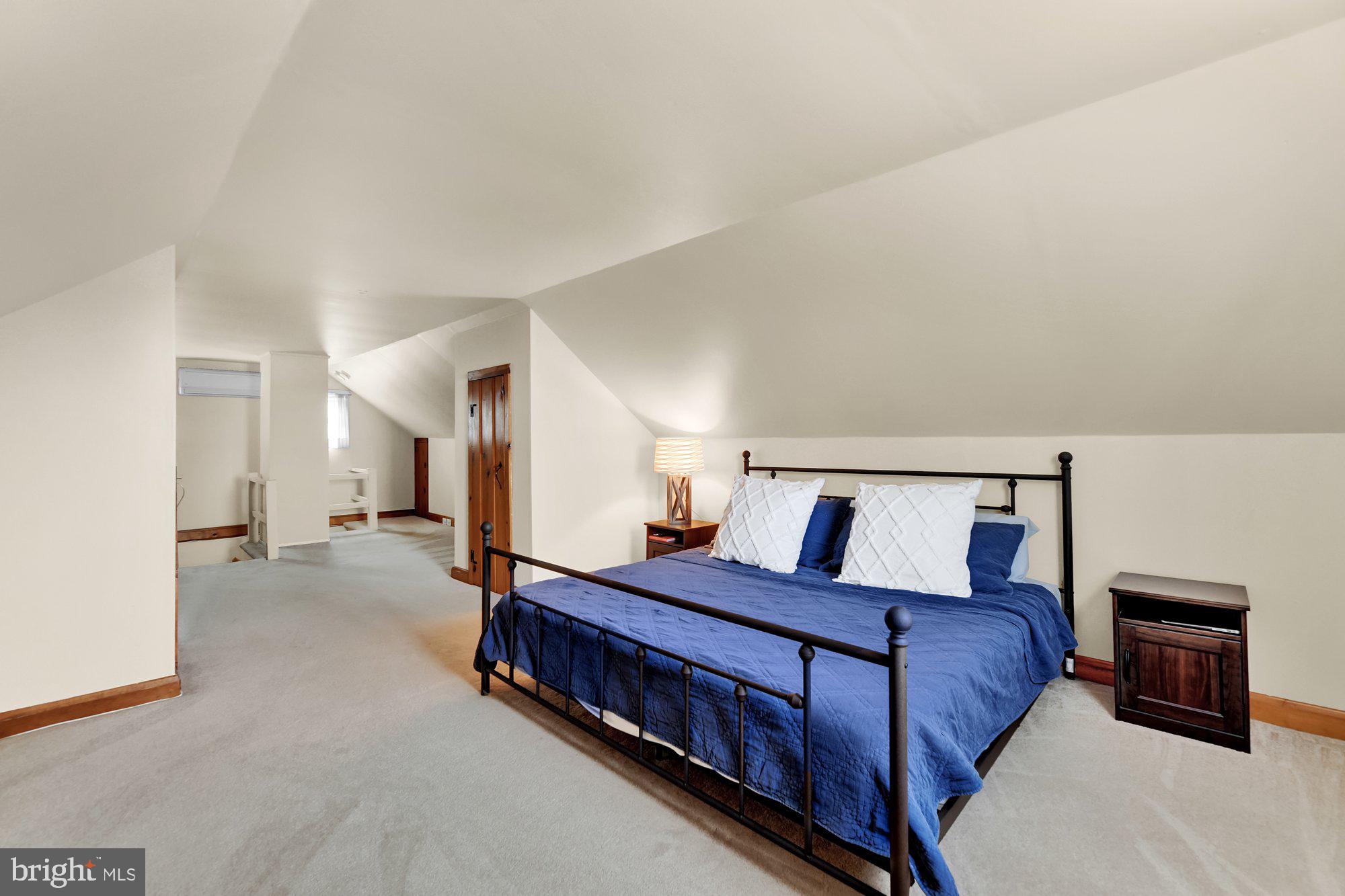 1107 Arran Road Baltimore, MD 21239 - Photo 16 of 29 a spacious bedroom with a bed and window