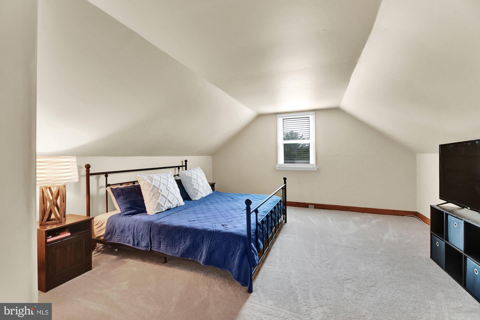 1107 Arran Road Baltimore, MD 21239 - Photo 17 of 29 a bed room with a bed and a television