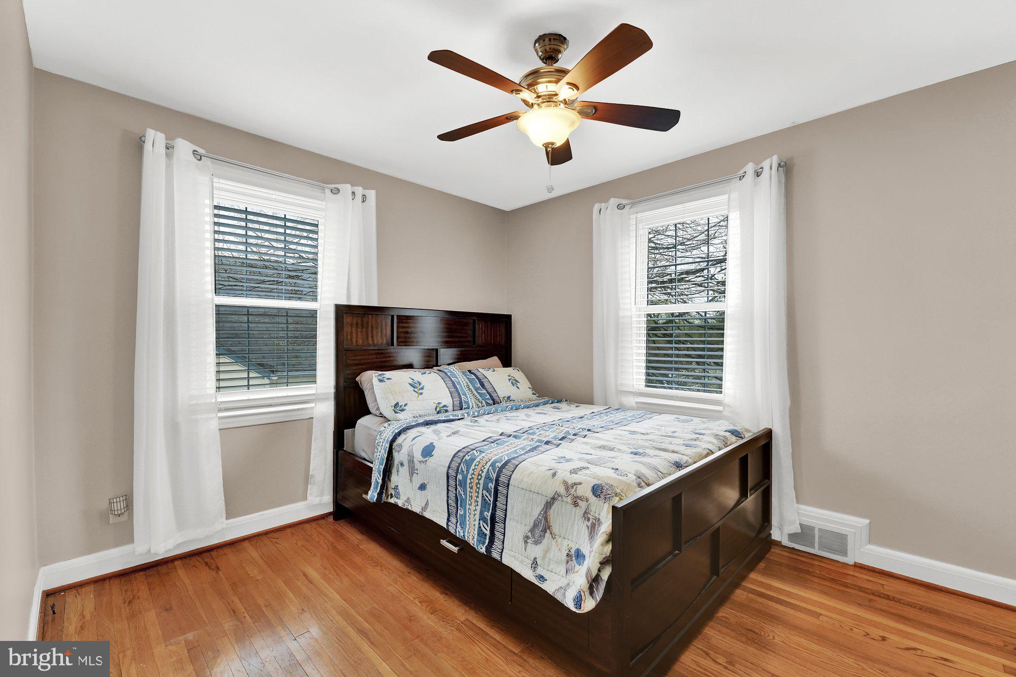 1107 Arran Road Baltimore, MD 21239 - Photo 19 of 29 a bedroom with a large bed and a window