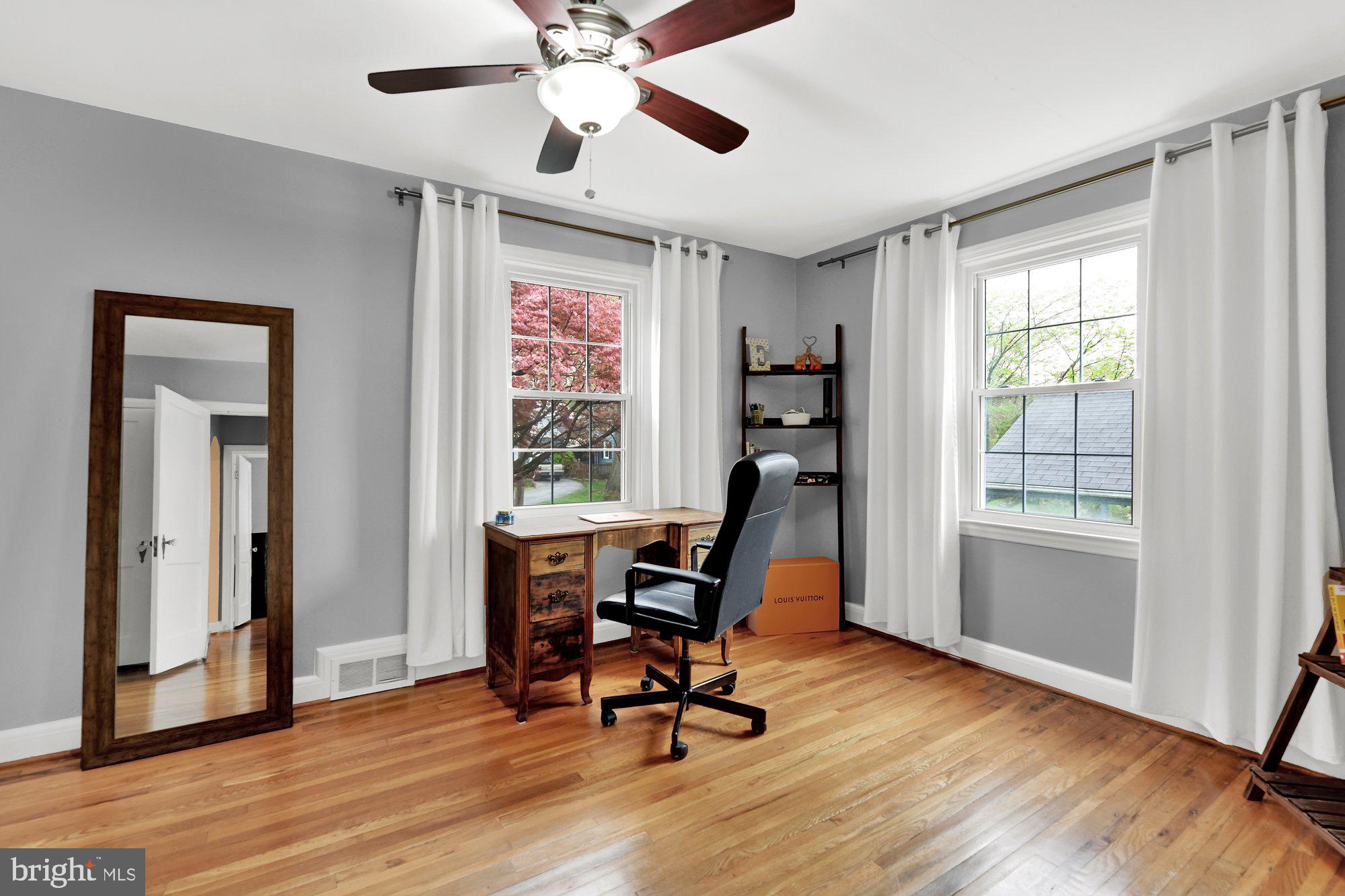 1107 Arran Road Baltimore, MD 21239 - Photo 21 of 29 a view of a workspace with furniture and a window
