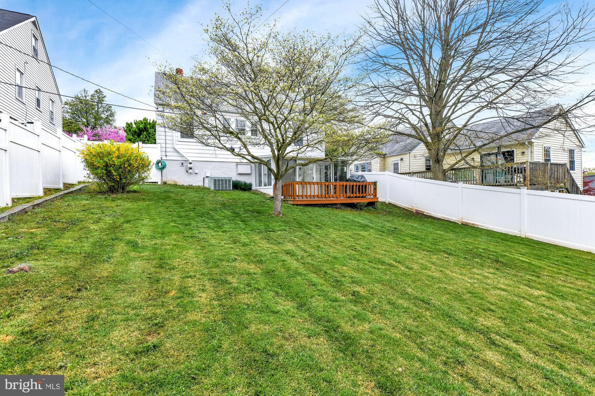 1107 Arran Road Baltimore, MD 21239 - Photo 28 of 29 a view of a house with a yard and sitting area