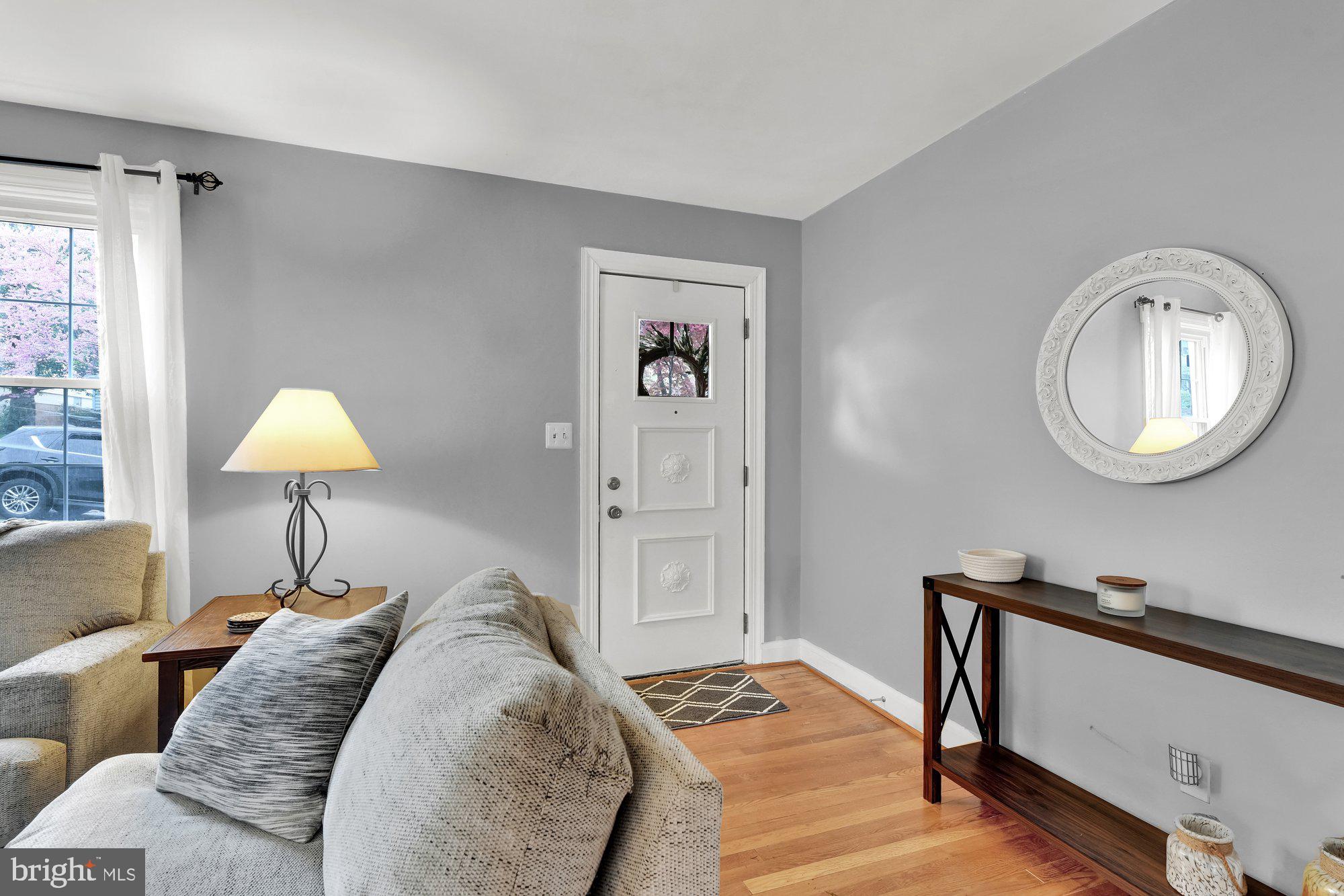 1107 Arran Road Baltimore, MD 21239 - Photo 5 of 29 a bed room with a bed and a lamp