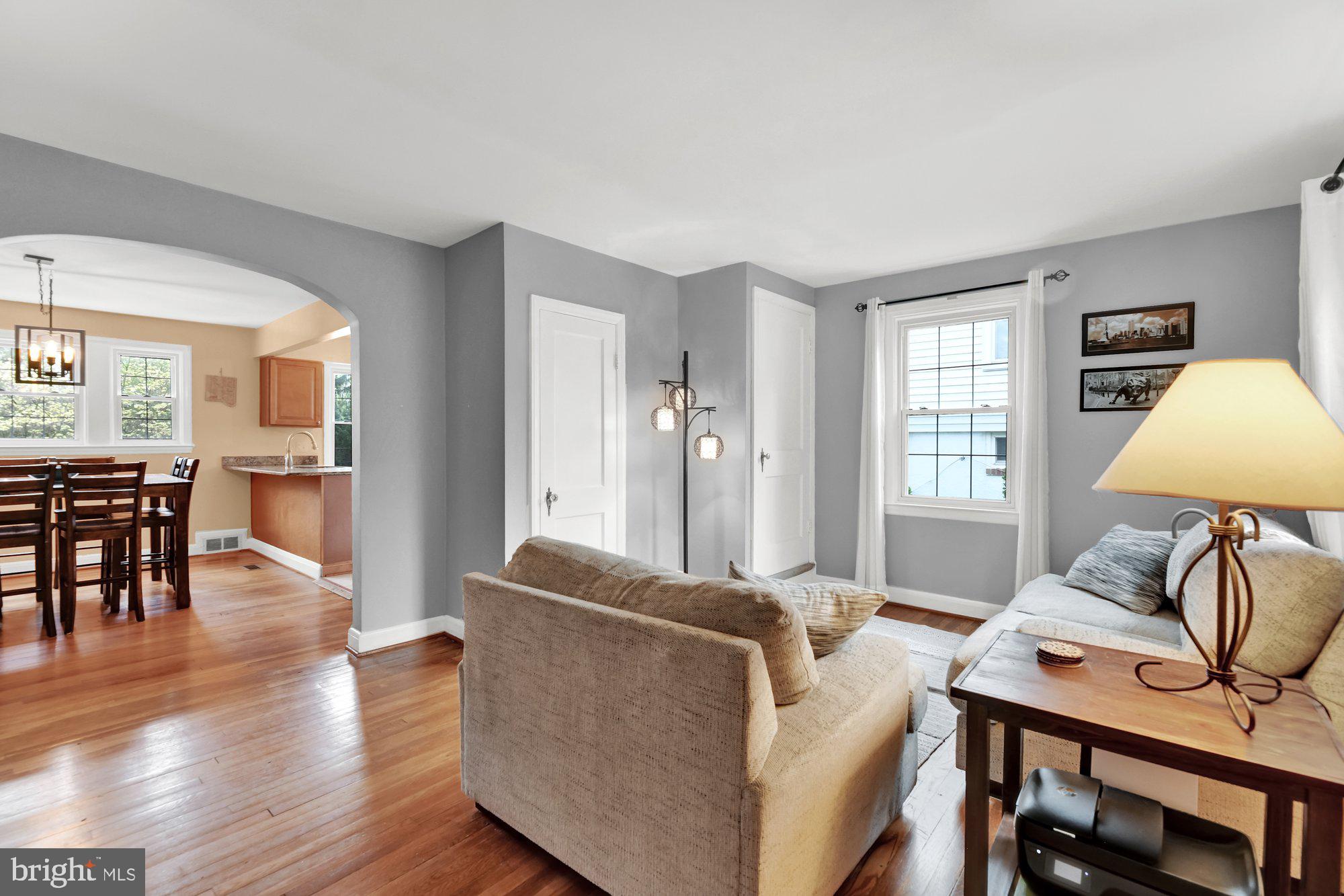 1107 Arran Road Baltimore, MD 21239 - Photo 6 of 29 a living room with furniture a dining table and a window