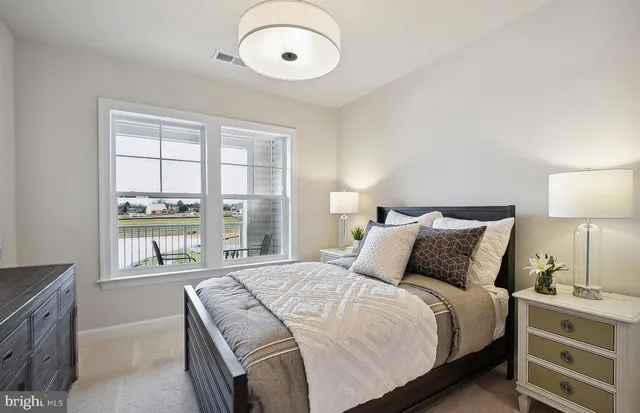 a white toilet sitting next to a white tub