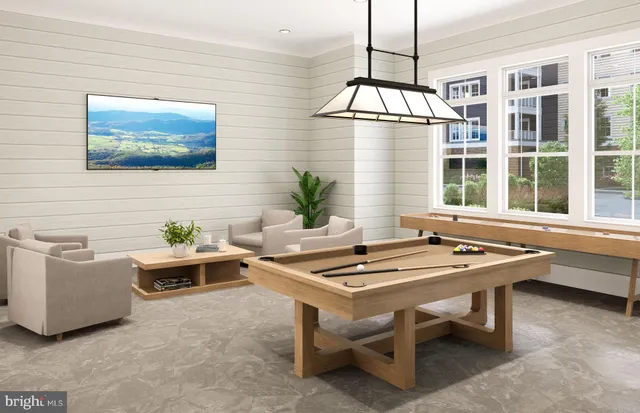 a living room with patio furniture and a table