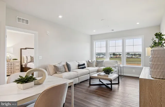 a living room with furniture and a table
