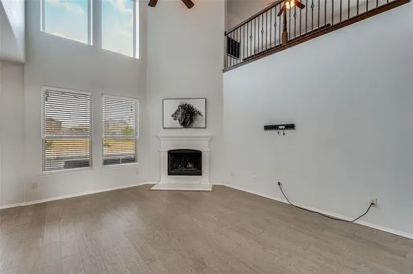 a view of empty room with a fireplace