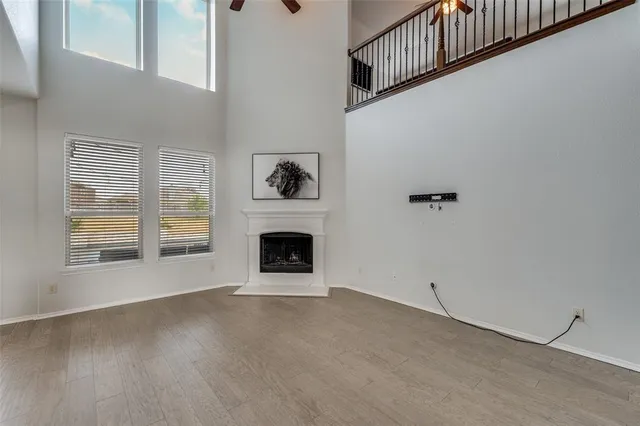 a view of empty room with a fireplace