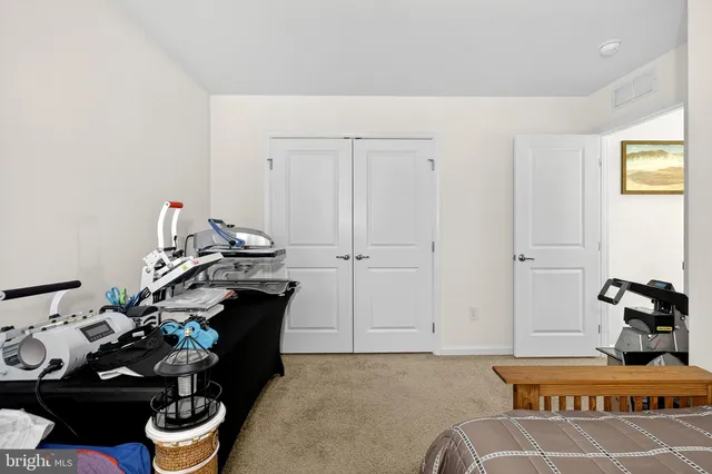 a bedroom with bed and a window