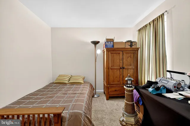 a bedroom with a bed and a cabinets