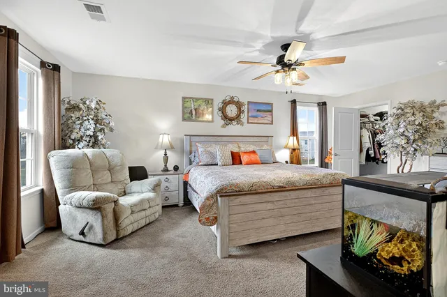 a bedroom with bed and window