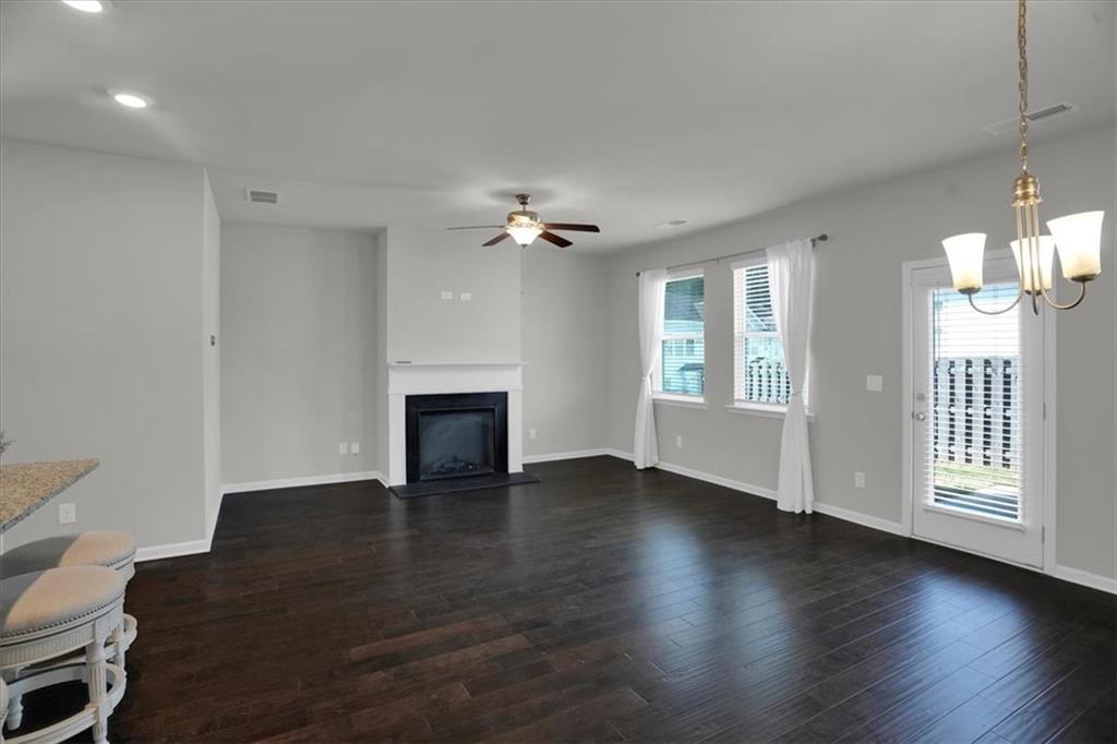 1506 Ashbrooke Trace Stone Mountain, GA 30083 - Photo 13 of 54 a view of an empty room with glass door and a window