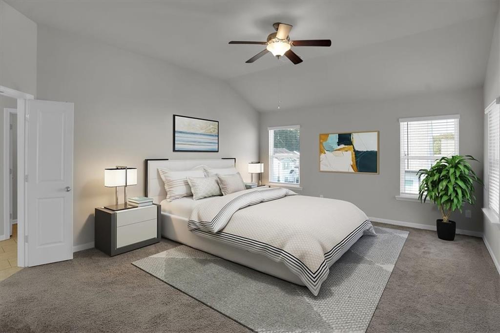 1506 Ashbrooke Trace Stone Mountain, GA 30083 - Photo 23 of 54 a spacious bedroom with a bed and a chandelier