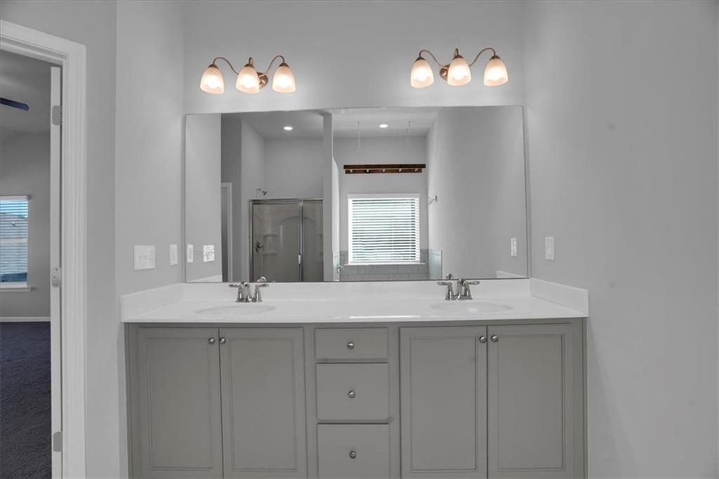 1506 Ashbrooke Trace Stone Mountain, GA 30083 - Photo 27 of 54 a bathroom with a sink and a mirror