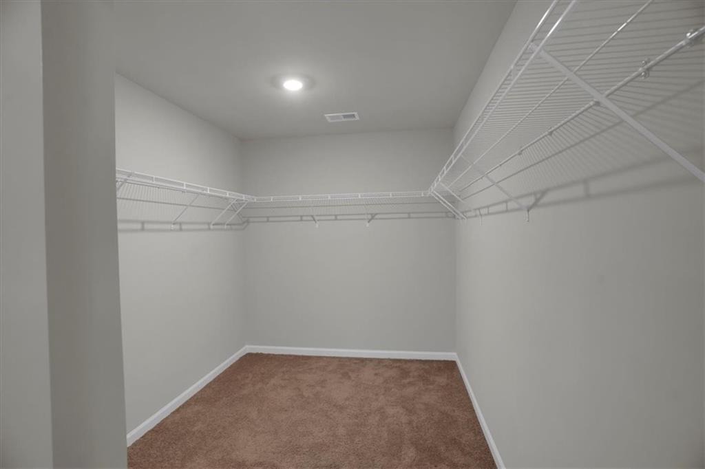 1506 Ashbrooke Trace Stone Mountain, GA 30083 - Photo 31 of 54 a view of a room with shelf on the wall