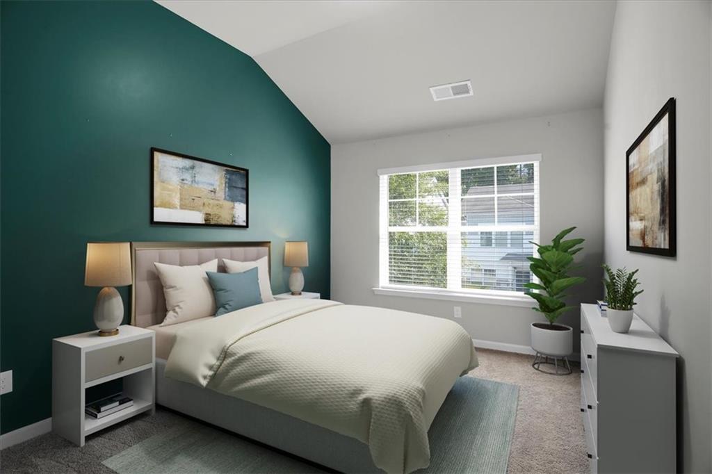 1506 Ashbrooke Trace Stone Mountain, GA 30083 - Photo 35 of 54 a bedroom with a large bed and potted plant