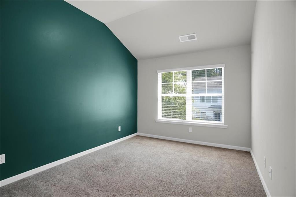 1506 Ashbrooke Trace Stone Mountain, GA 30083 - Photo 36 of 54 an empty room with a window