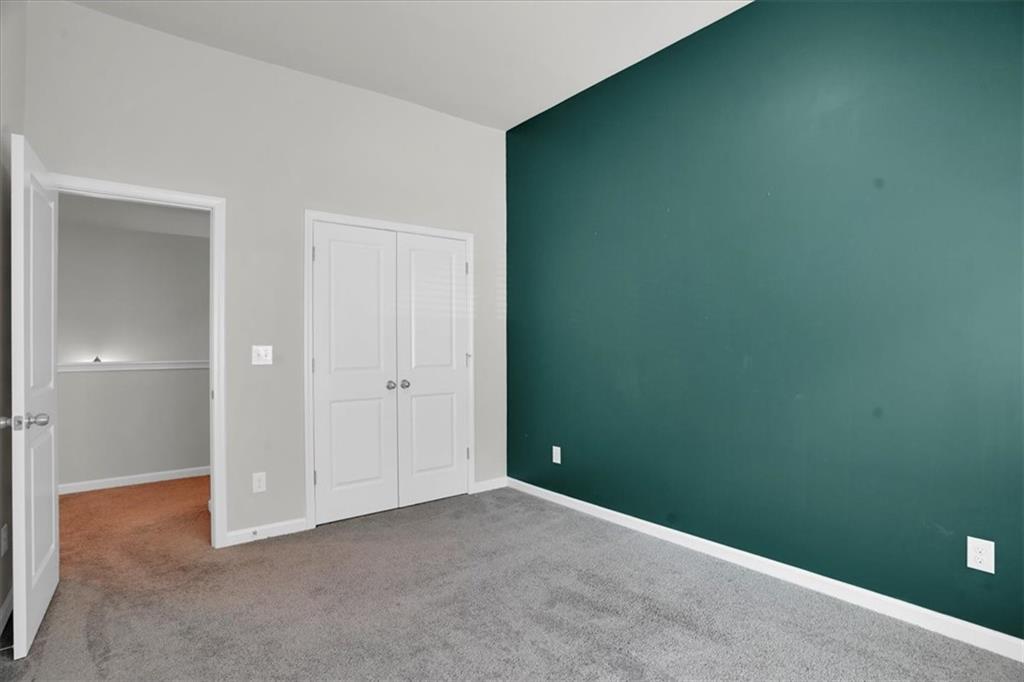 1506 Ashbrooke Trace Stone Mountain, GA 30083 - Photo 37 of 54 an empty room with closet