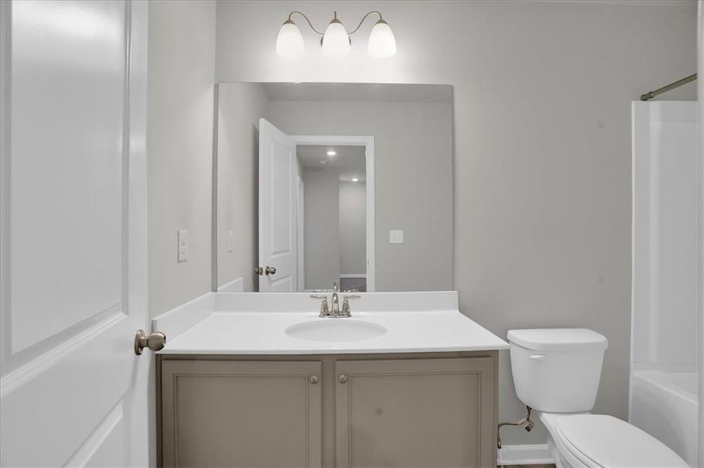 1506 Ashbrooke Trace Stone Mountain, GA 30083 - Photo 39 of 54 a bathroom with a sink and a toilet
