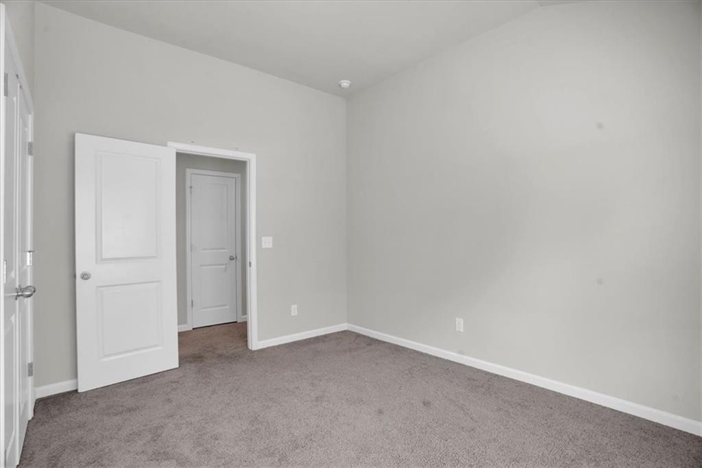 1506 Ashbrooke Trace Stone Mountain, GA 30083 - Photo 41 of 54 a view of an empty room