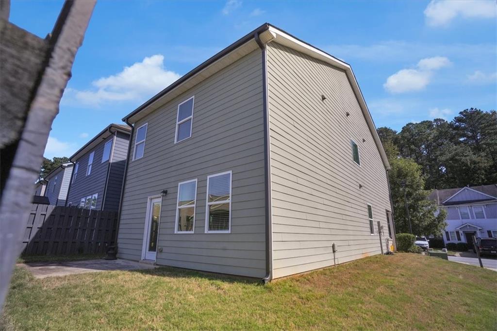 1506 Ashbrooke Trace Stone Mountain, GA 30083 - Photo 50 of 54 a view of a house with a backyard