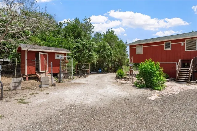 a view of a cars park in front of a house