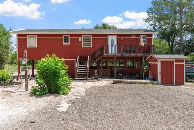 a room with pool table and windows
