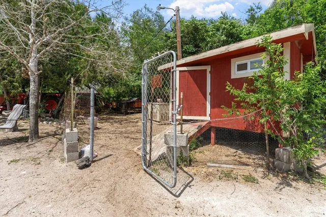 a living room with furniture a window and a ceiling fan