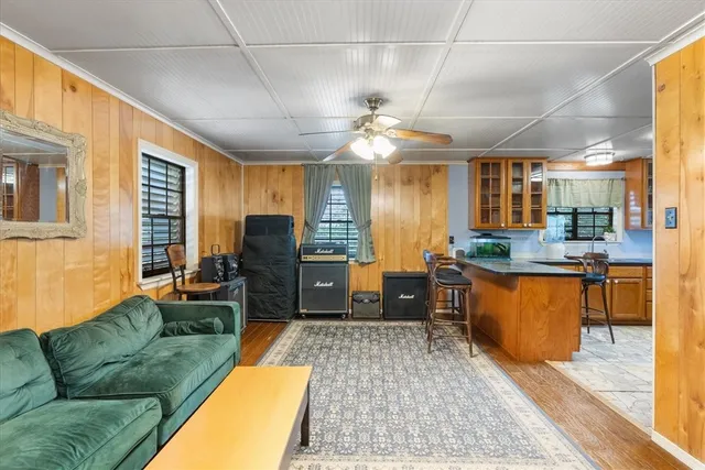 a kitchen with stainless steel appliances granite countertop a refrigerator a sink a stove and island