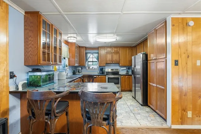 a kitchen with granite countertop a sink and a window