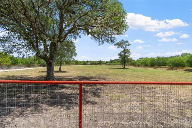 a view of a lake with a yard