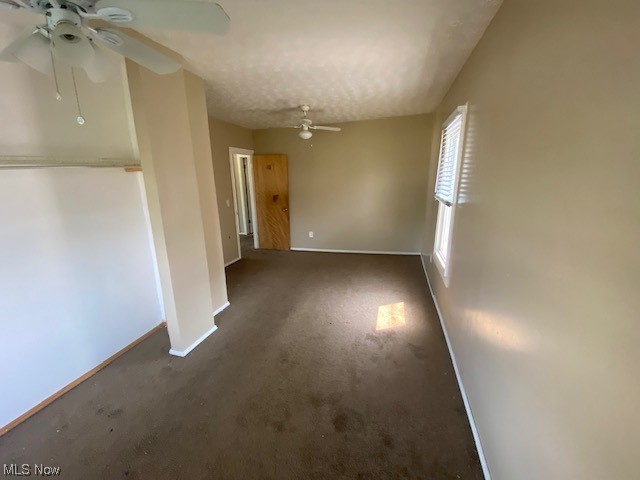 921 Rudyard Road Cleveland, OH 44110 - Photo 6 of 31 Carpeted empty room featuring ceiling fan