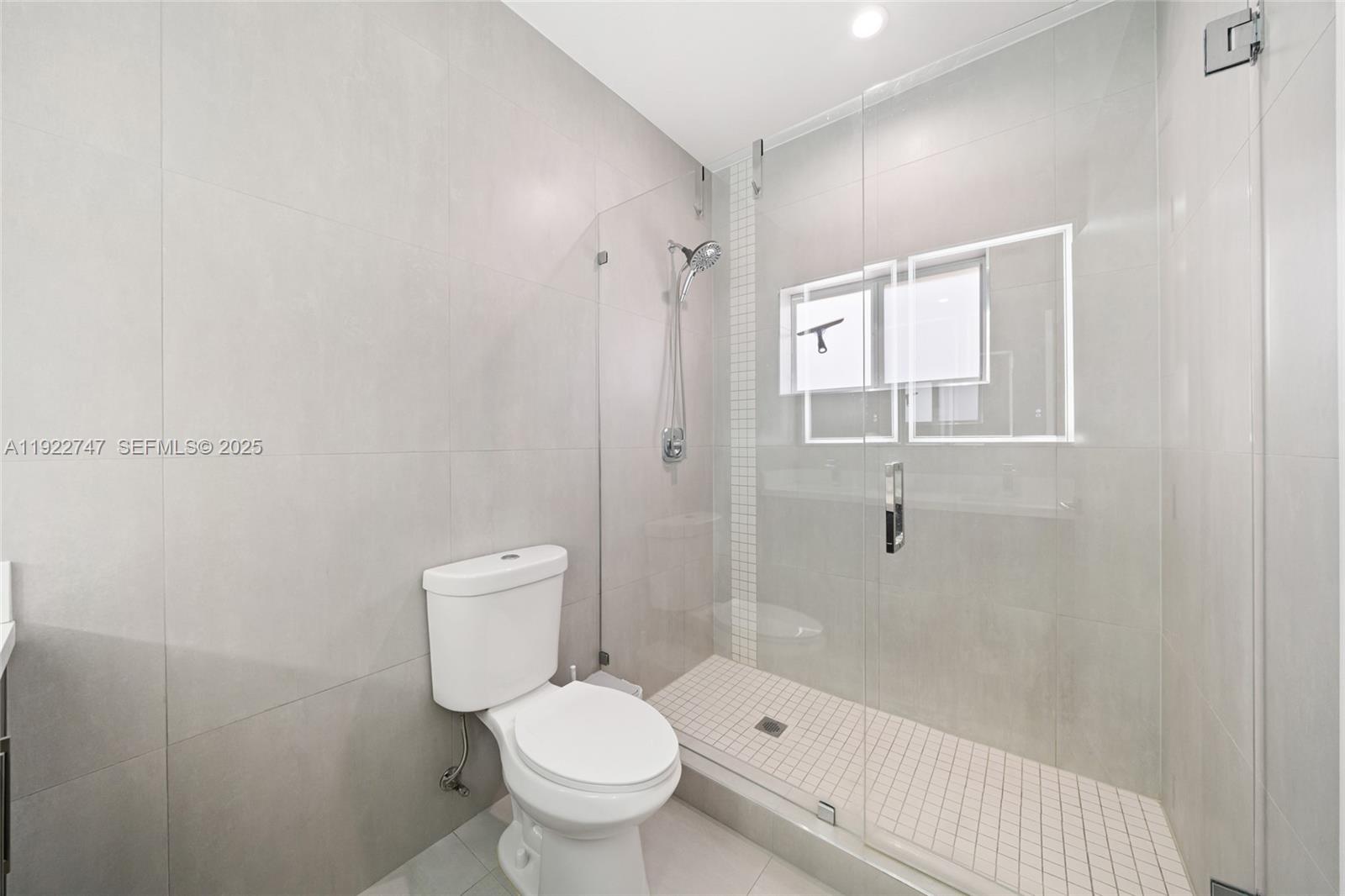 17341 Southwest 304th Street Homestead, FL 33030 - Photo 14 of 25 a bathroom with a toilet and a shower