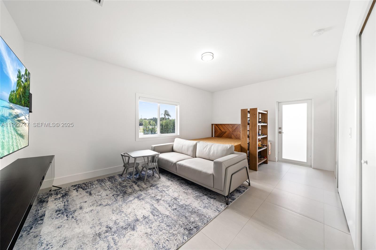 17341 Southwest 304th Street Homestead, FL 33030 - Photo 15 of 25 a living room with furniture and a window
